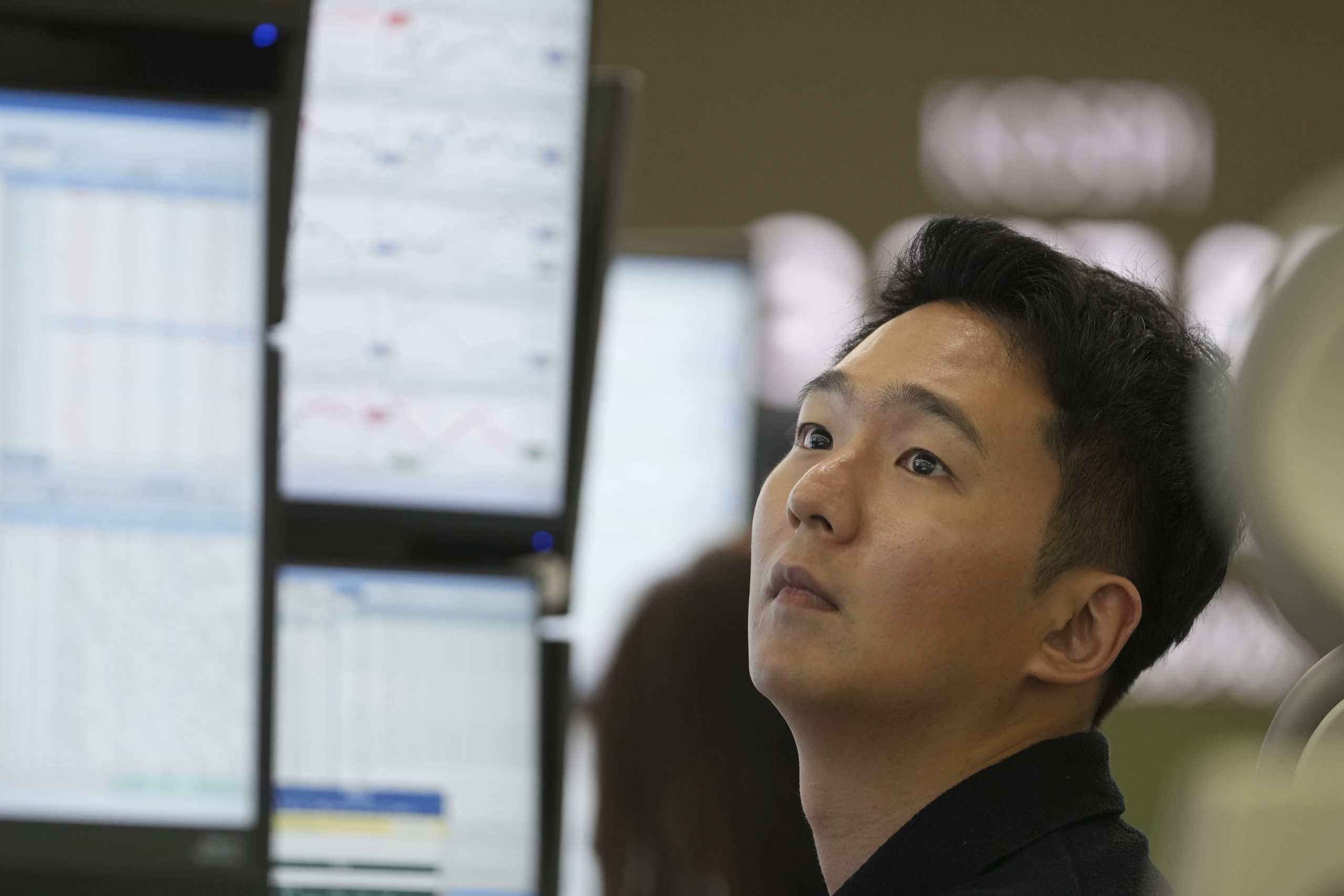 Asian shares are mixed after stocks add a bit to their records on Wall Street