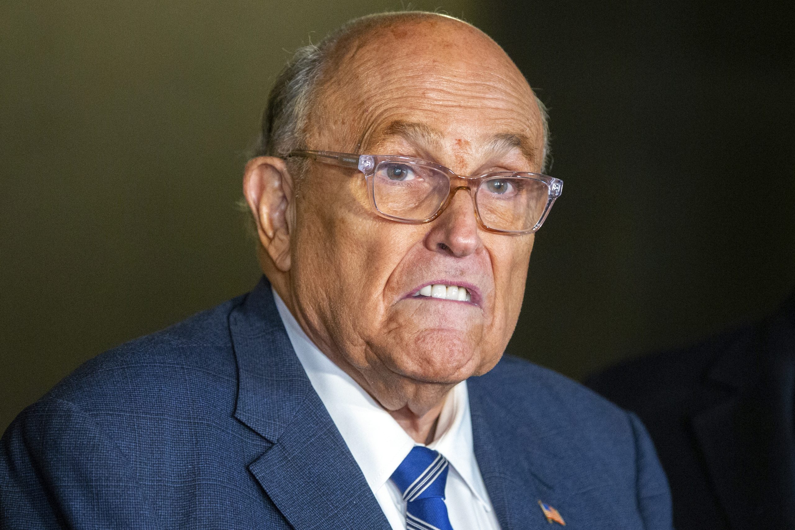 Rudy Giuliani leaves the hospital after being injured in a car crash in New Hampshire