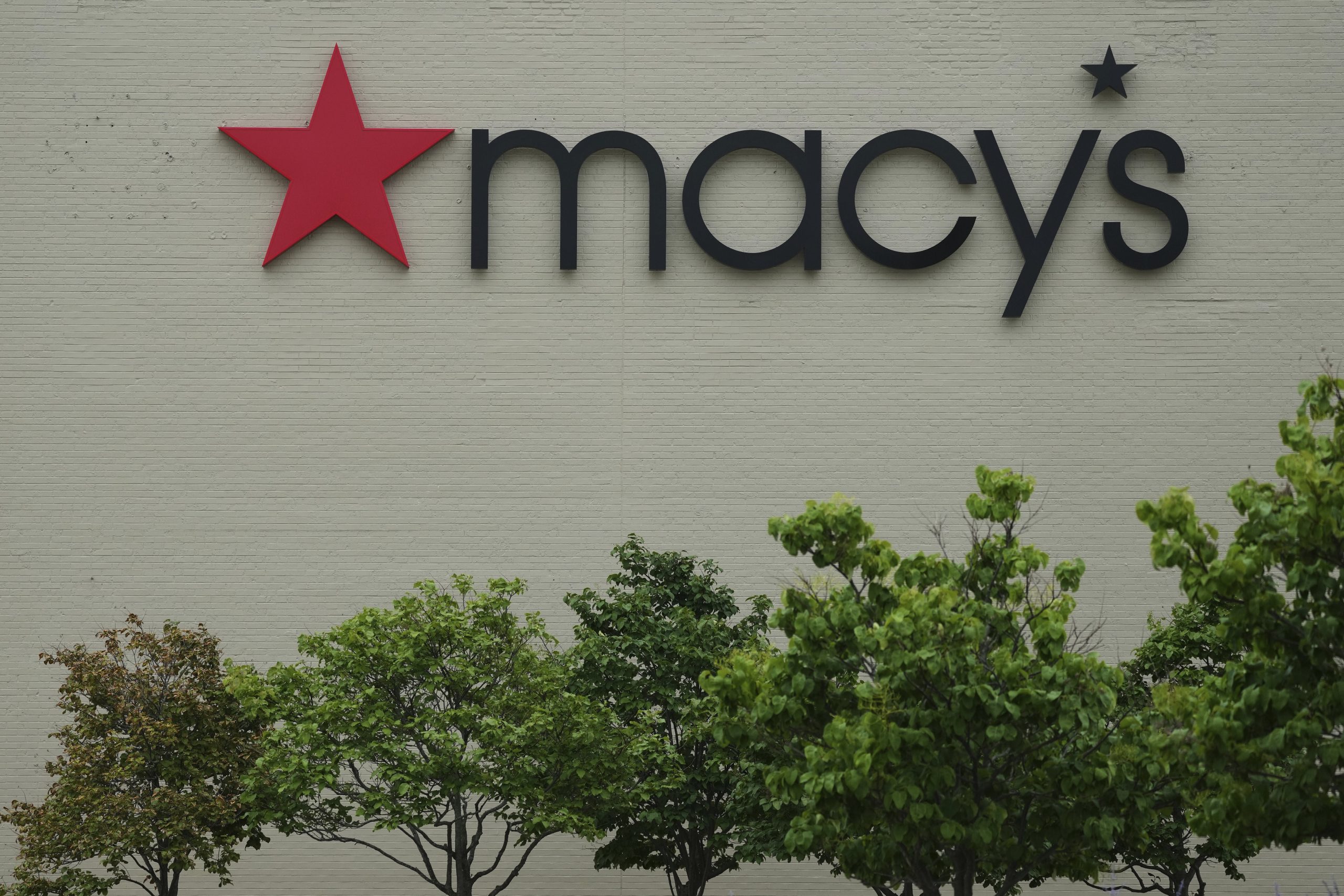Macy’s quarterly profit and sales fall but it raises guidance with those declines limited