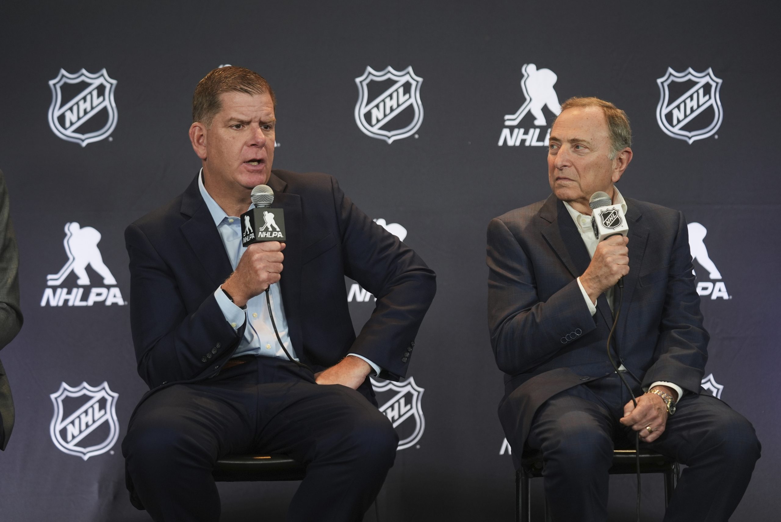 NHL to implement a playoff salary cap beginning this season, AP source says