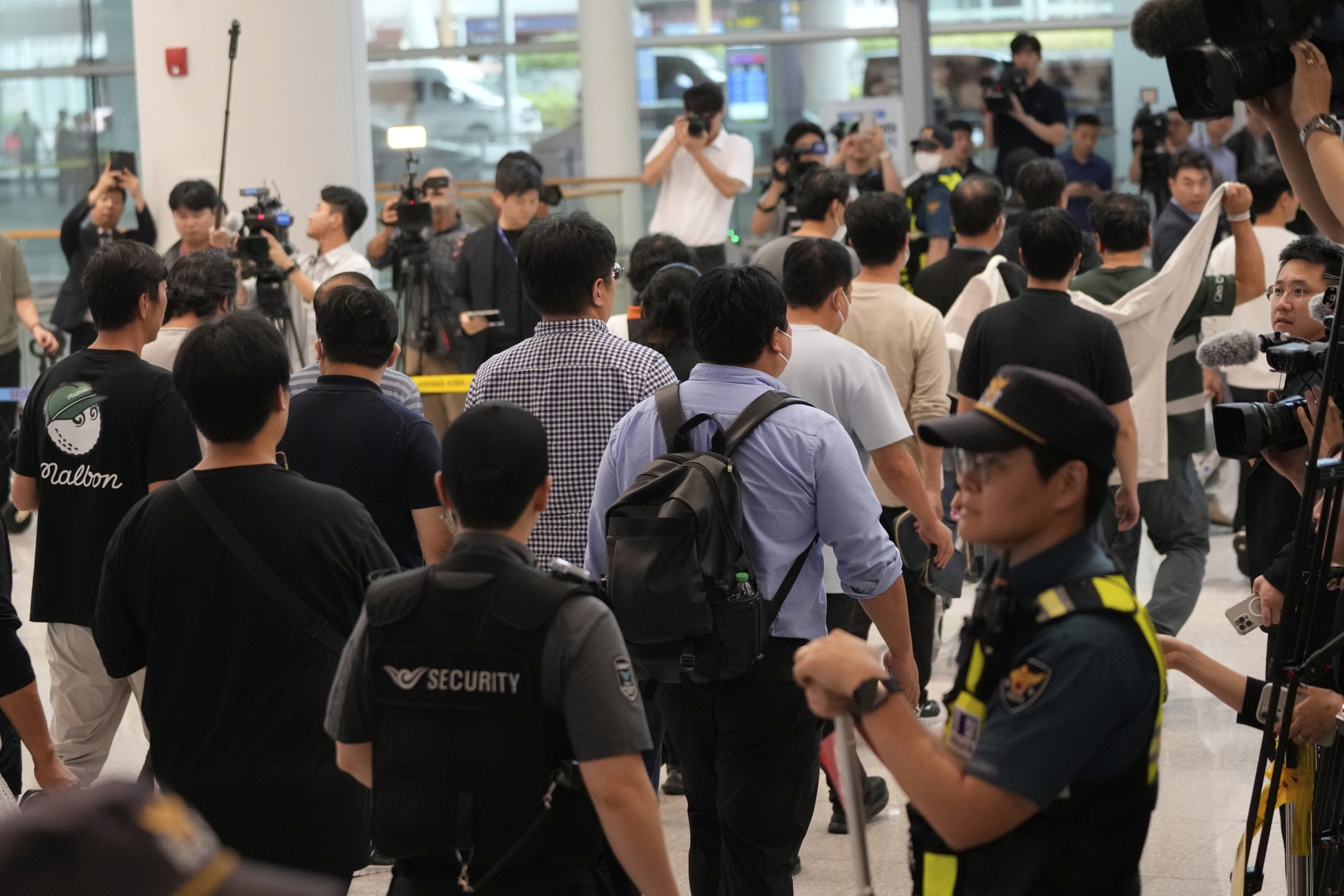 South Korean workers released after days of detention in Georgia return home