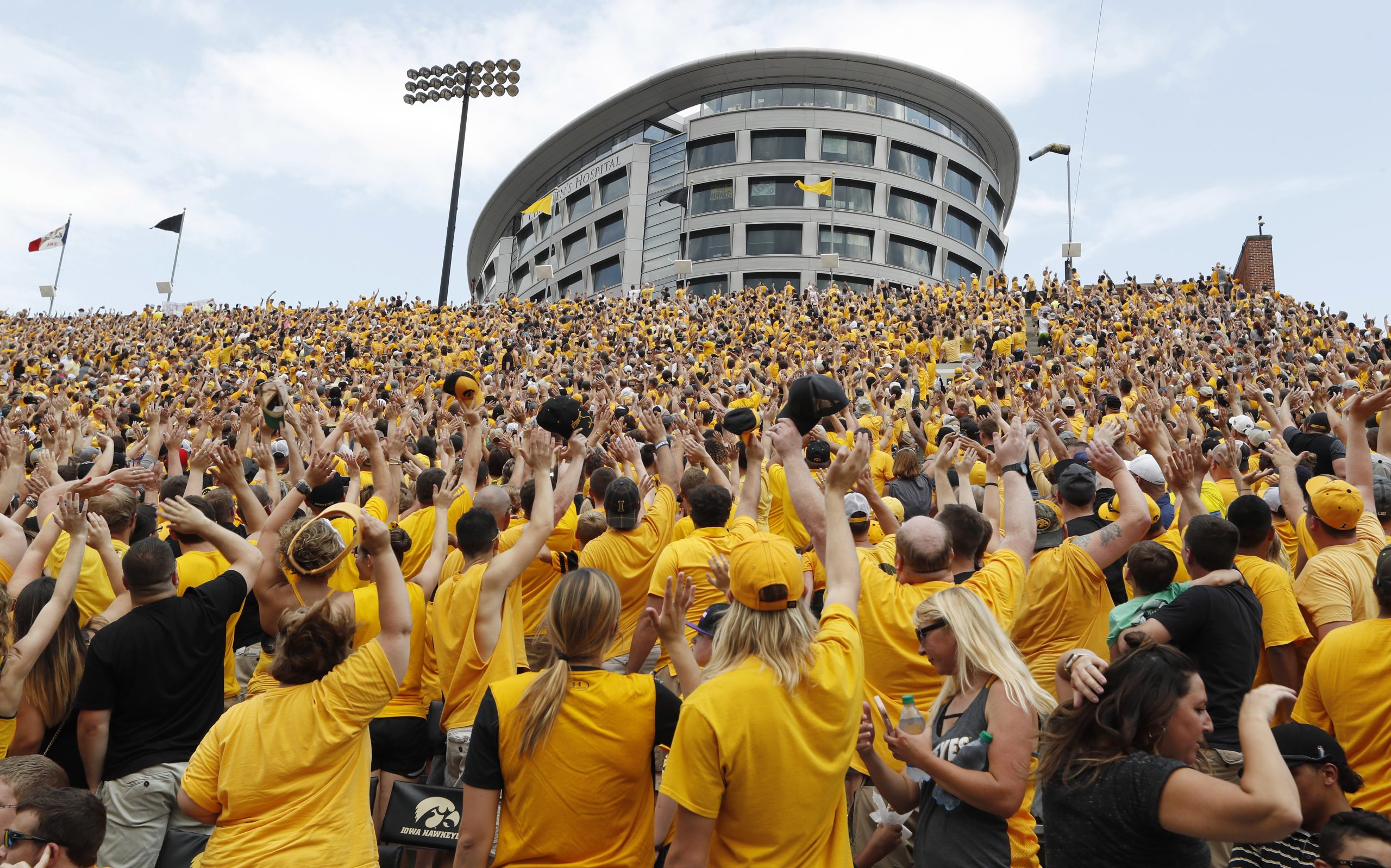 College football traditions: ‘Hawkeye Wave’ bonds everyone in stadium with kids in adjacent hospital