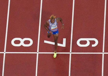 Athletics-Lyles blasts into 200m final with 19.51 seconds