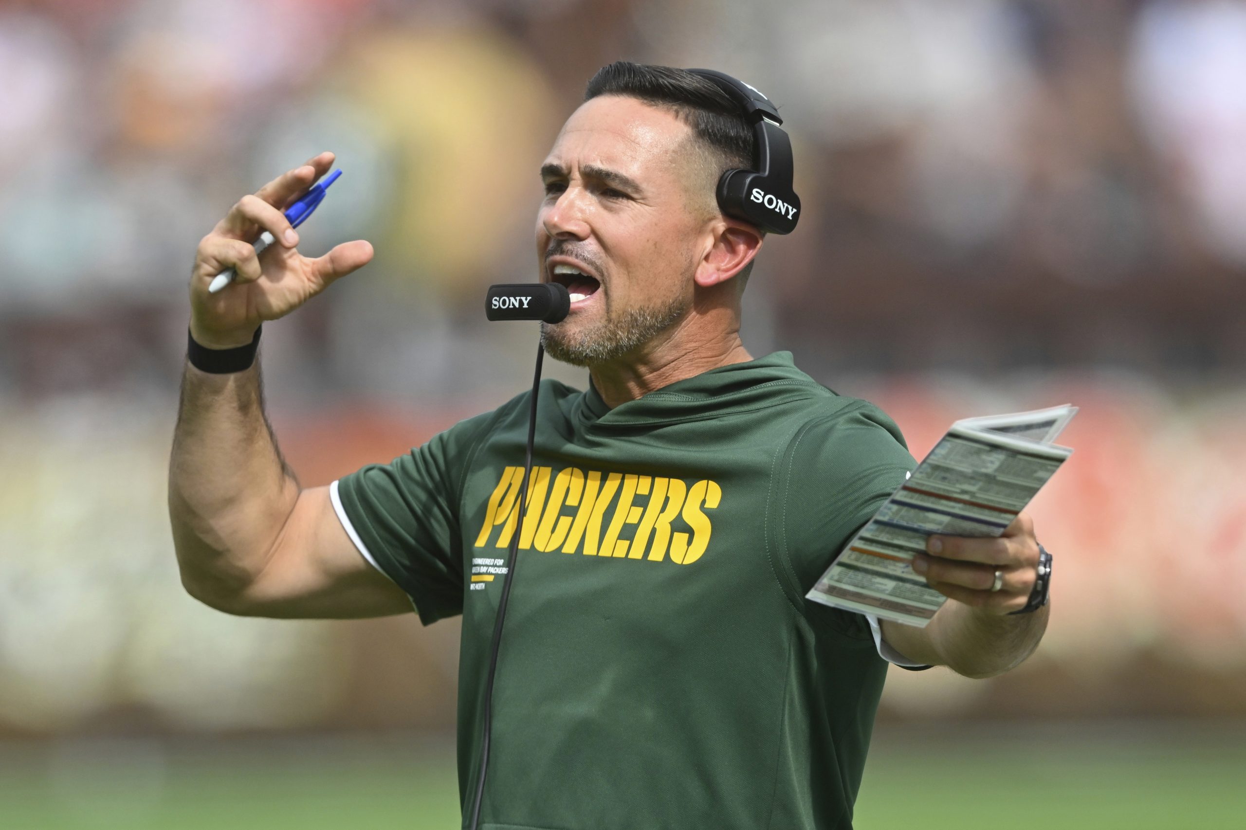 Amid the chaos during NFL games, coaches aim to maintain calm inside the headset