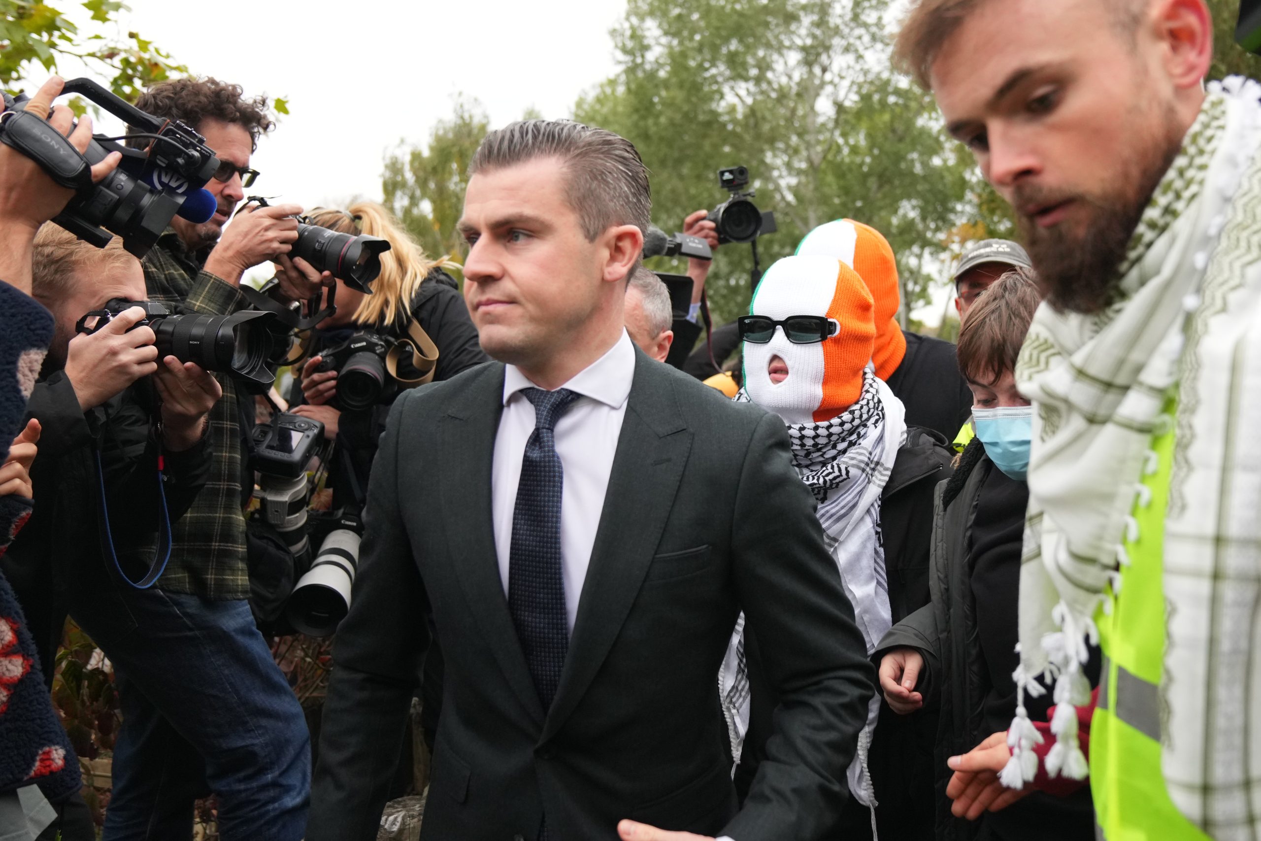 A British court throws out a terror-related charge against a member of the Irish rap group Kneecap