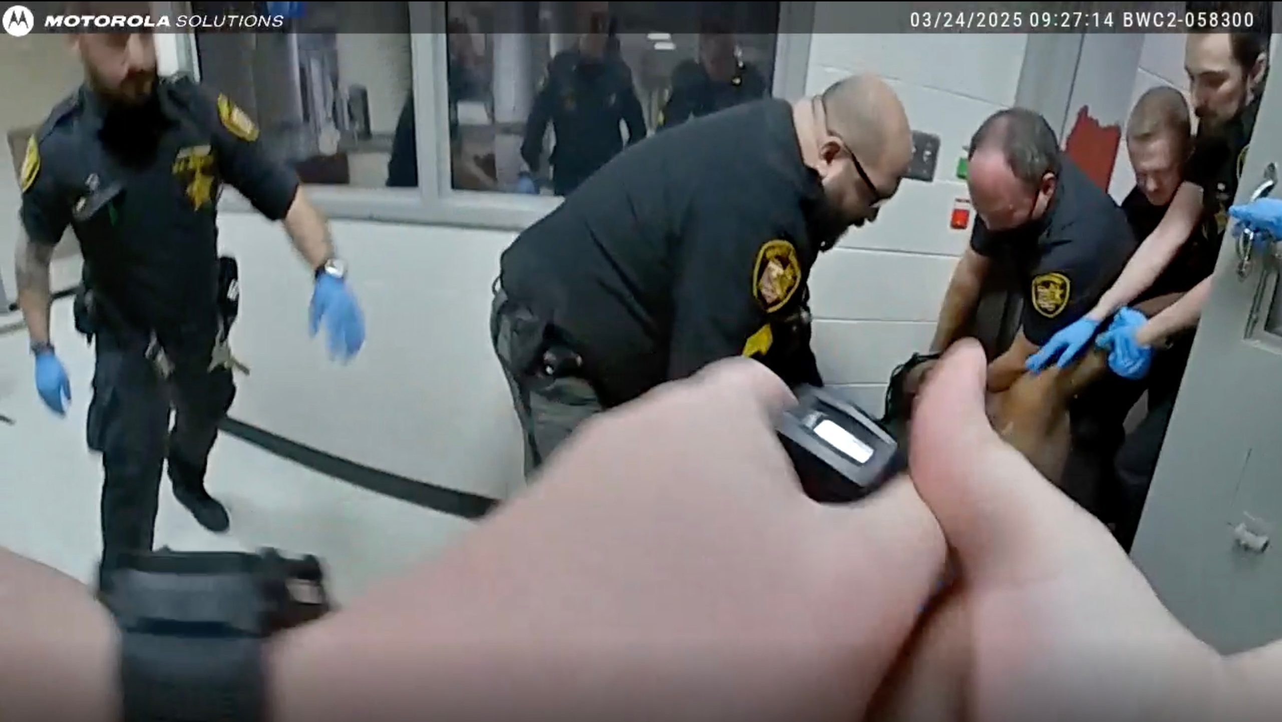 Ohio county agrees to $7M settlement over man’s death after jail guards restrained him, family says