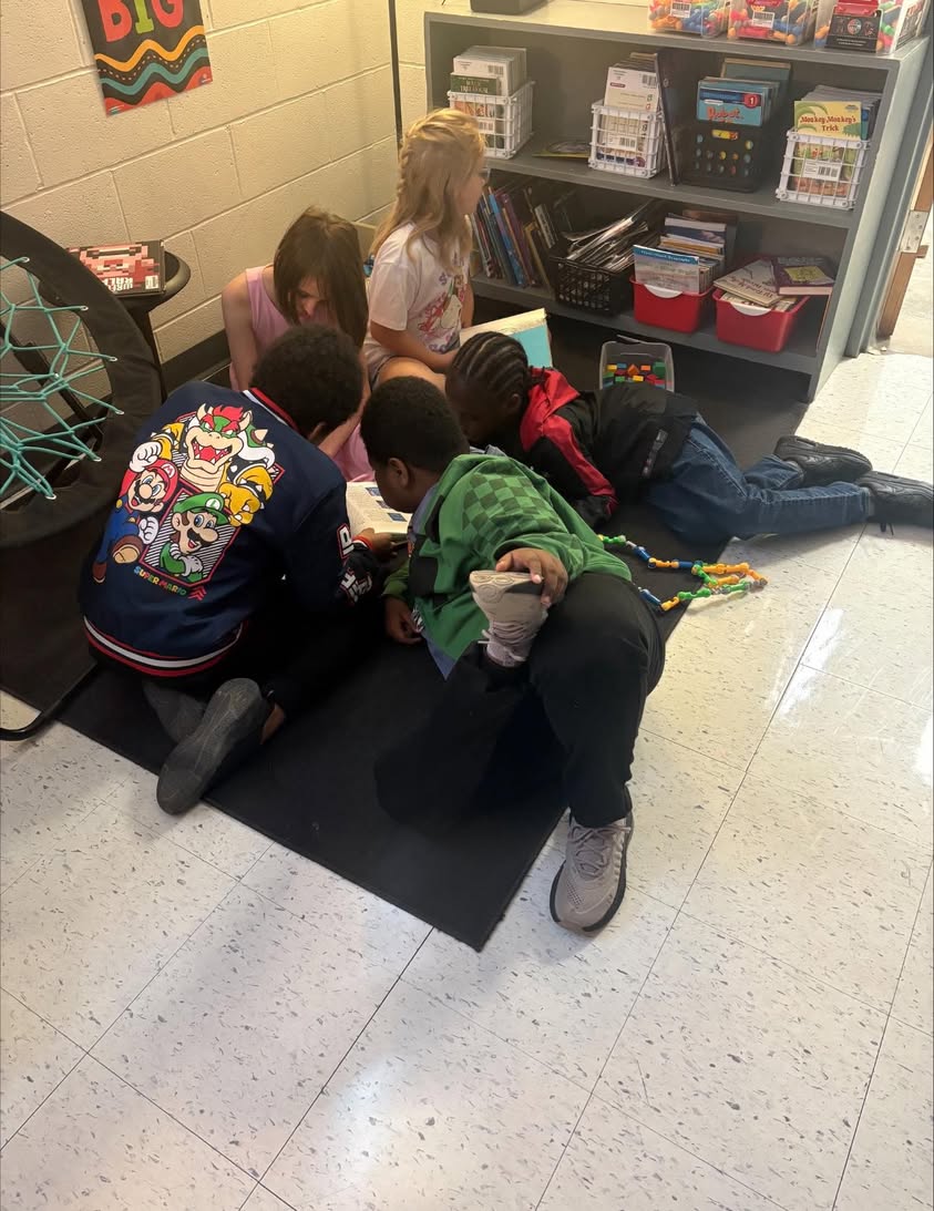 Miss Ward’s students checking out a cool book a student brought from home on their brain break. #edisonbombers #MAC185