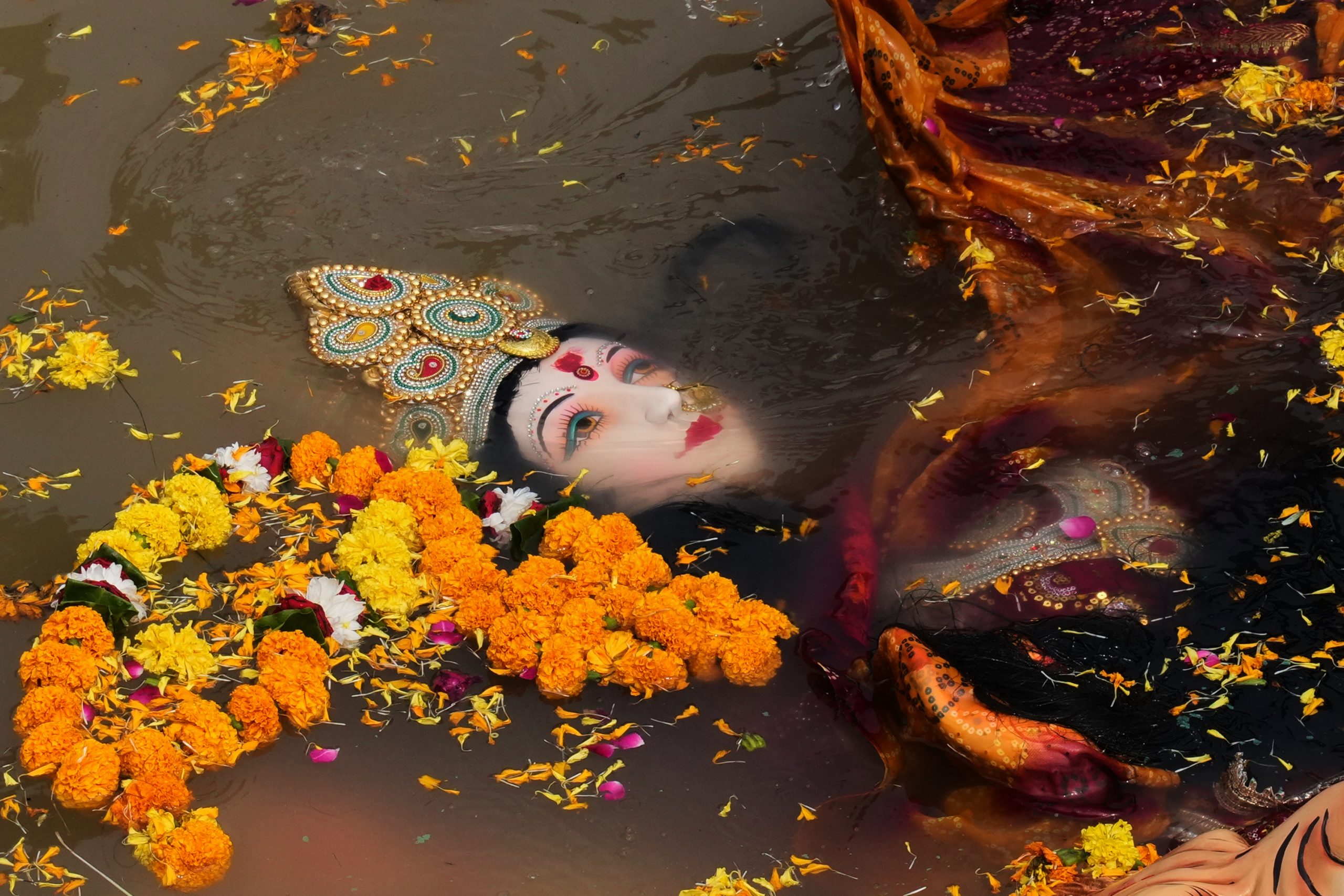 Hindu festival photos are about fire and water, good and evil — simple but universal concepts