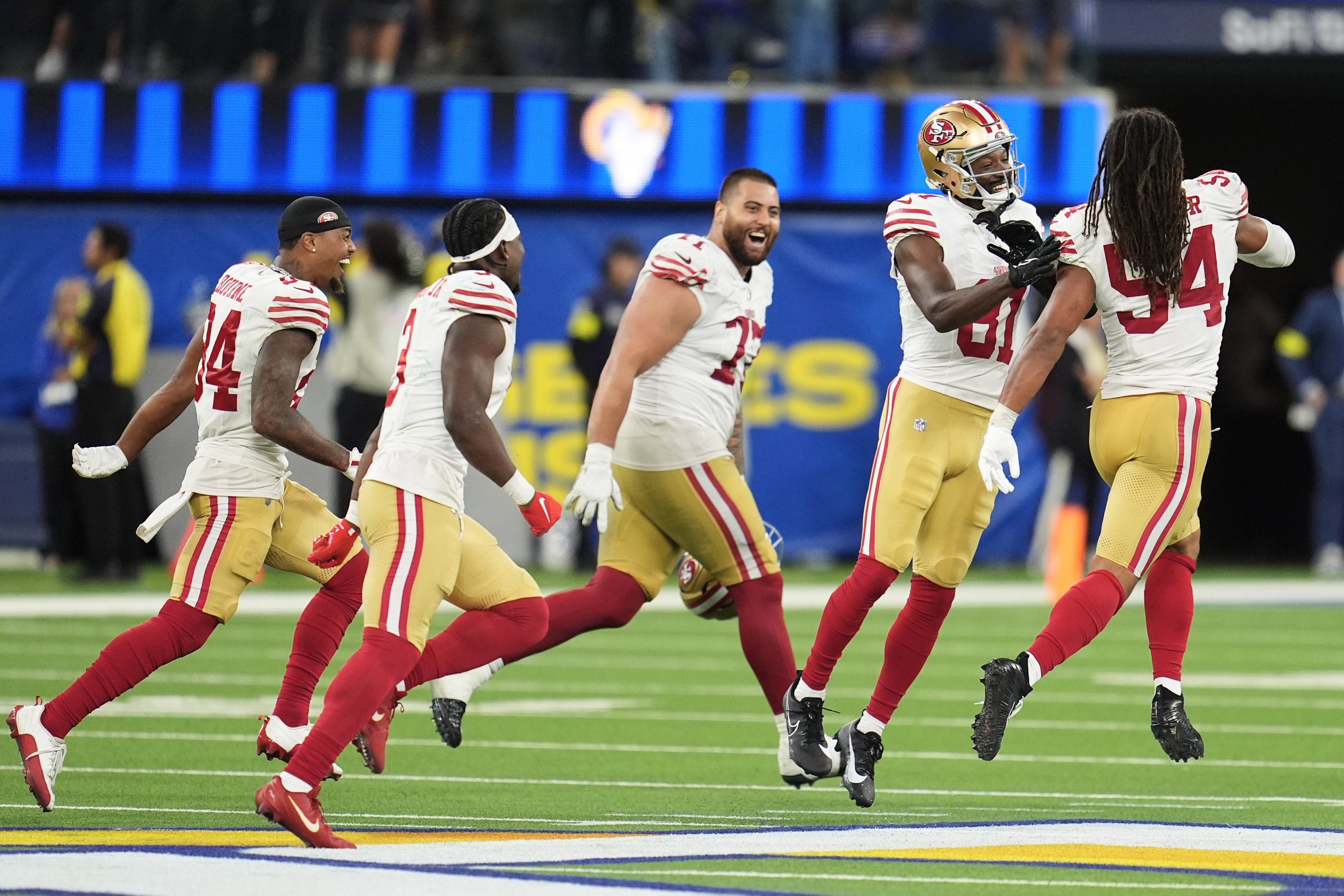 Short-handed 49ers stop Rams on downs in overtime, preserving a 26-23 victory