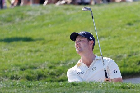 Golf-Whaley saves par and ‘both hands’ in close encounter with alligator
