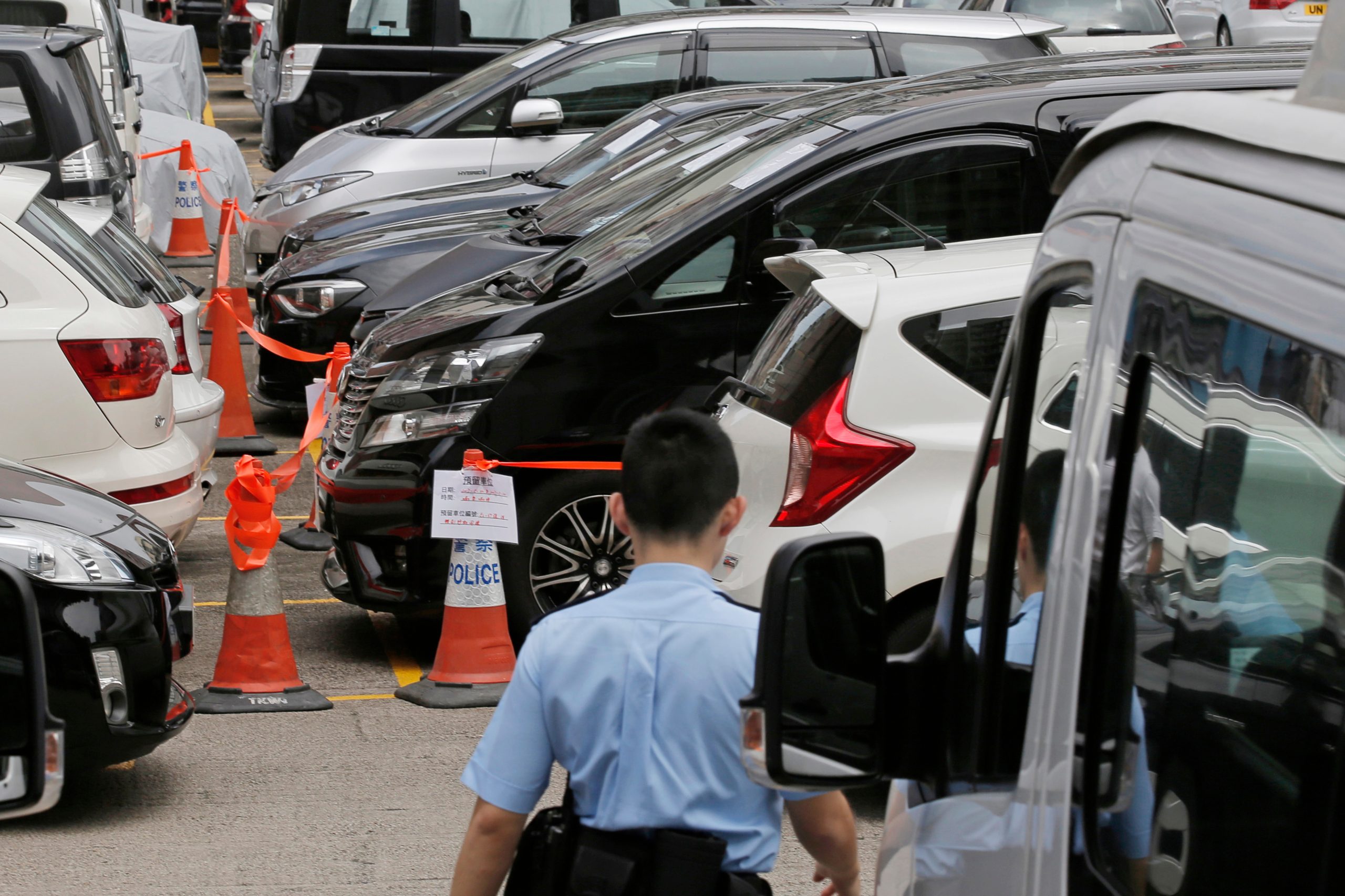 Hong Kong lawmakers pass bill to regulate ride-hailing services like Uber