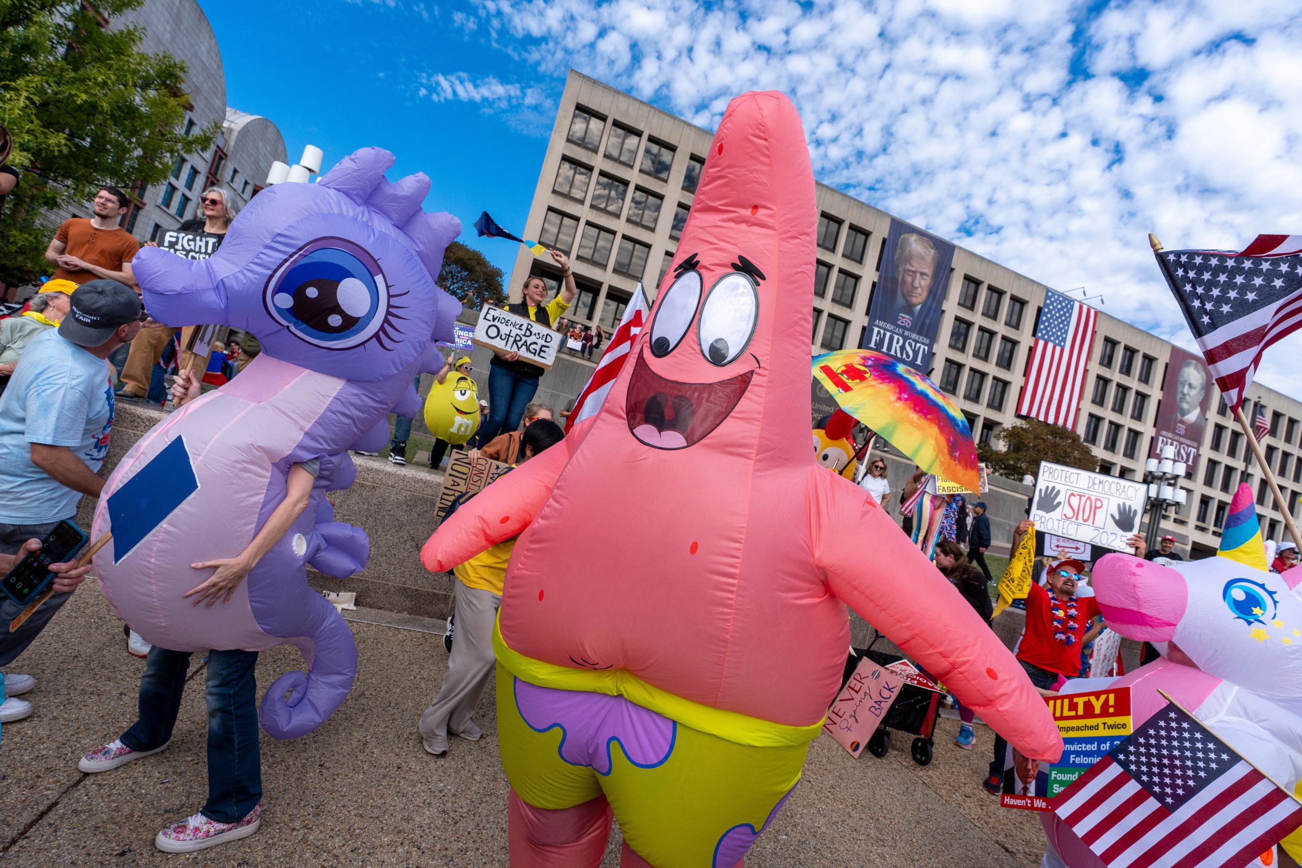 Inflatable costumes used to deflate tensions at rallies against Trump, in photos