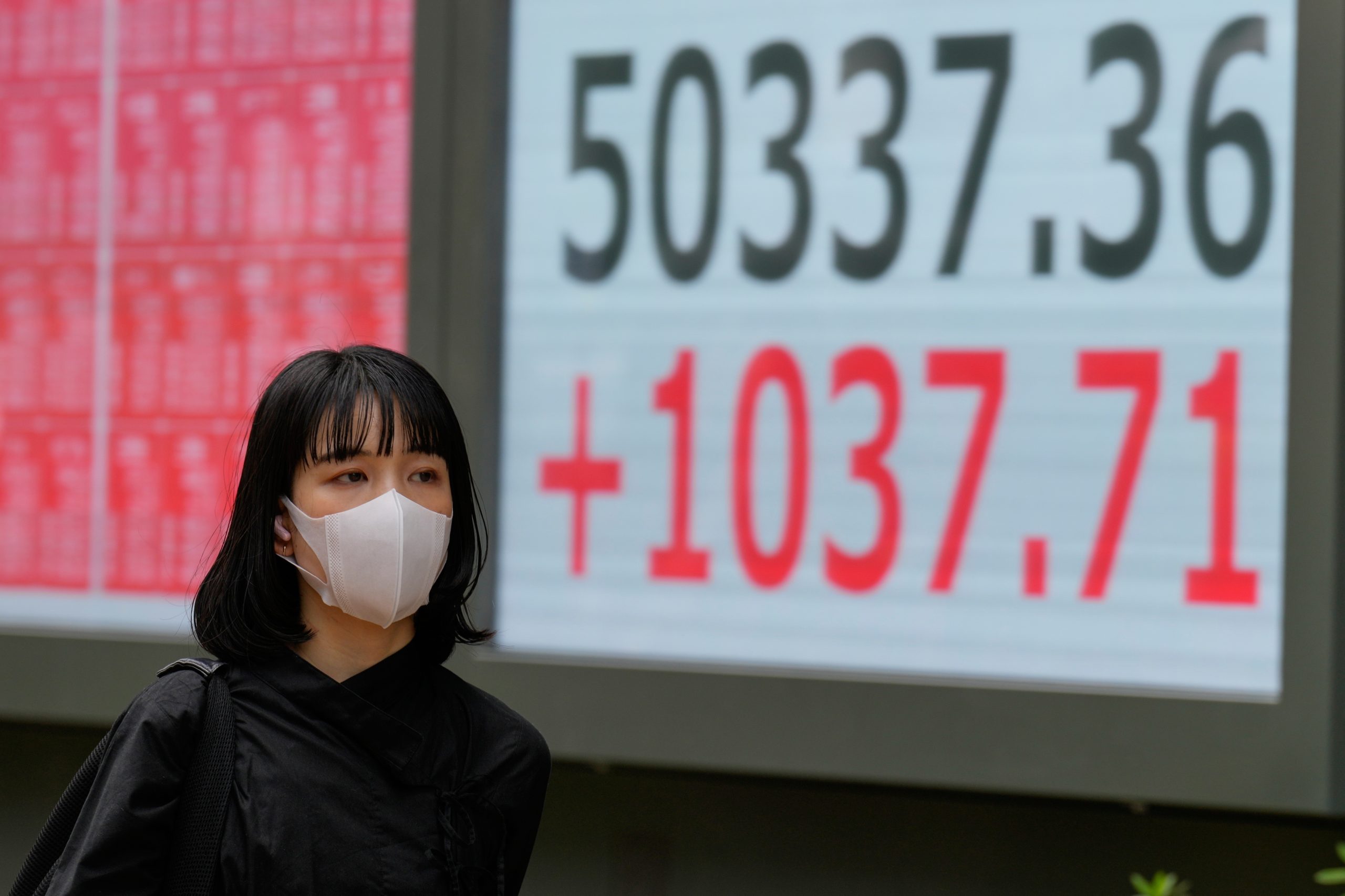 U.S. futures jump and world shares are mixed as Trump says he expects a trade deal with China