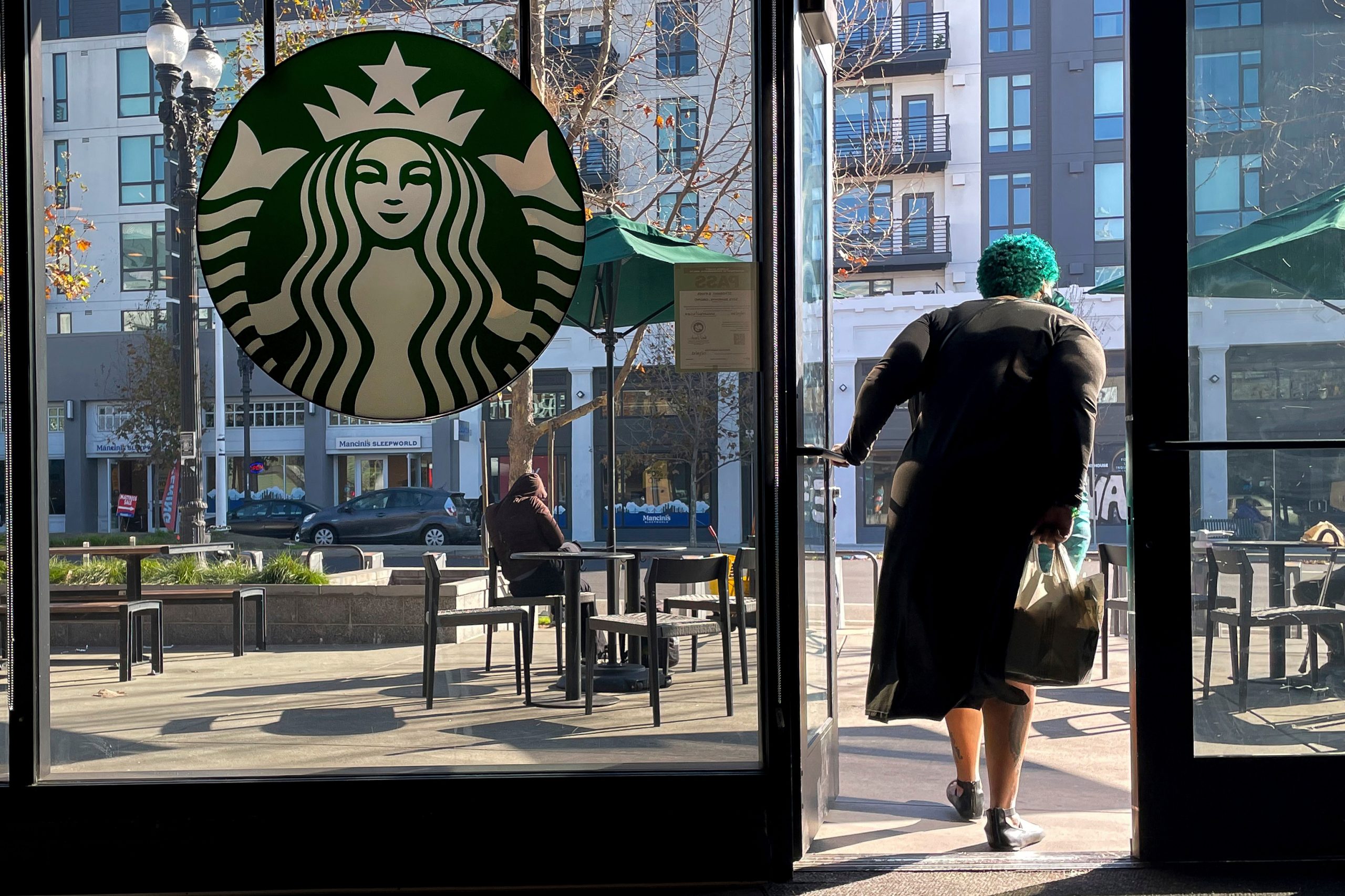 Starbucks sales improve but store closures and layoffs take a bite out of profits