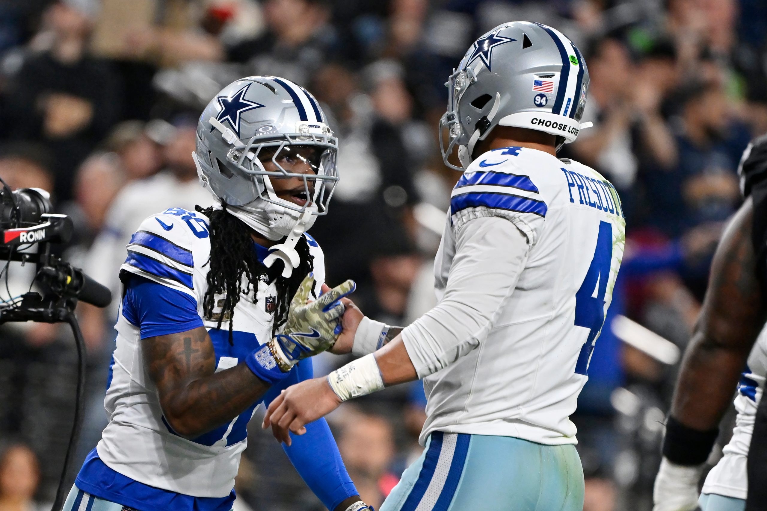 Cowboys honor Kneeland, then get 4 TD passes from Prescott in 33-16 win over Raiders