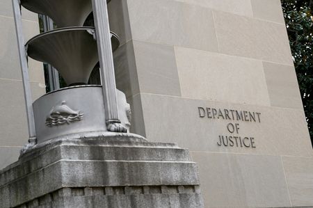 Former FBI employee sues DOJ, says unjustly fired over Pride Flag display