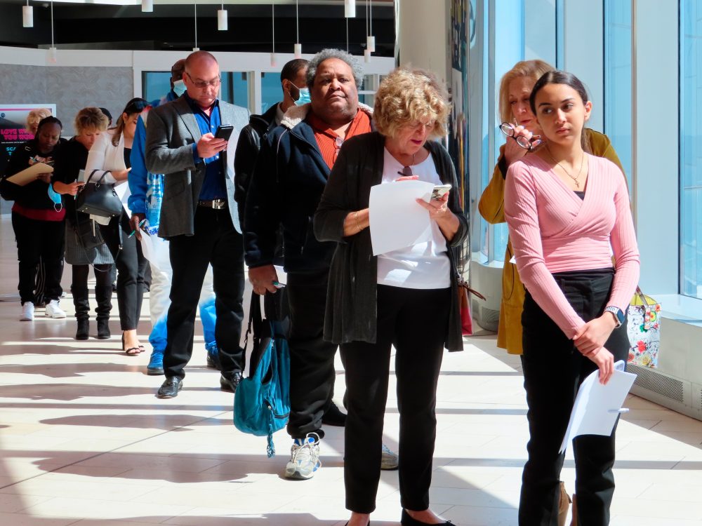 Fewer Americans sought unemployment benefits last week as job cuts stay low
