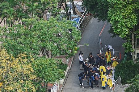 A week after Hong Kong’s deadly fire, some residents return for belongings