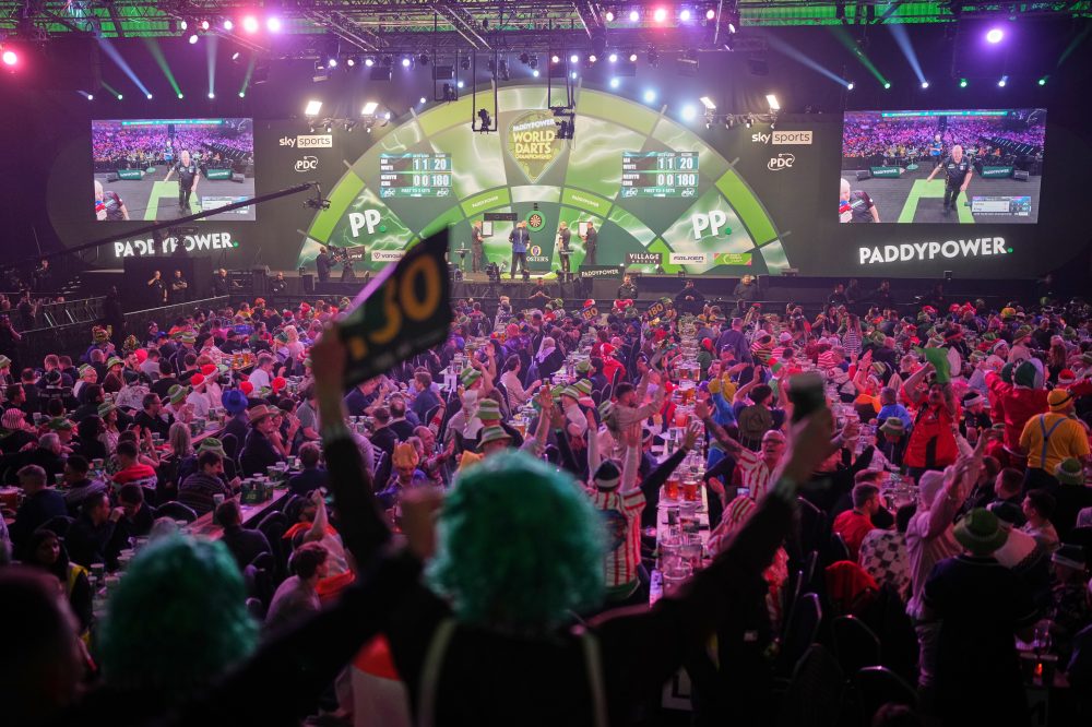 Costumes and competitors light up the World Darts Championships in London, in photos