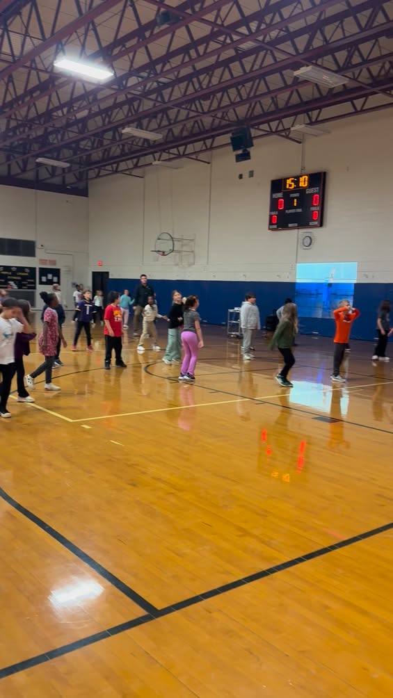 PE is having a blast learning a line dance. #edisonbombers #MAC185
