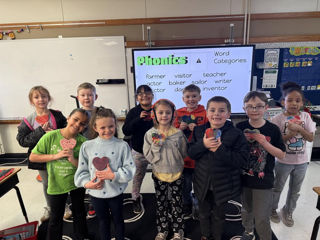 Mrs. Baxter’s class gets to take home their hearts they made with their adopt a classroom, The Crafty Coop.